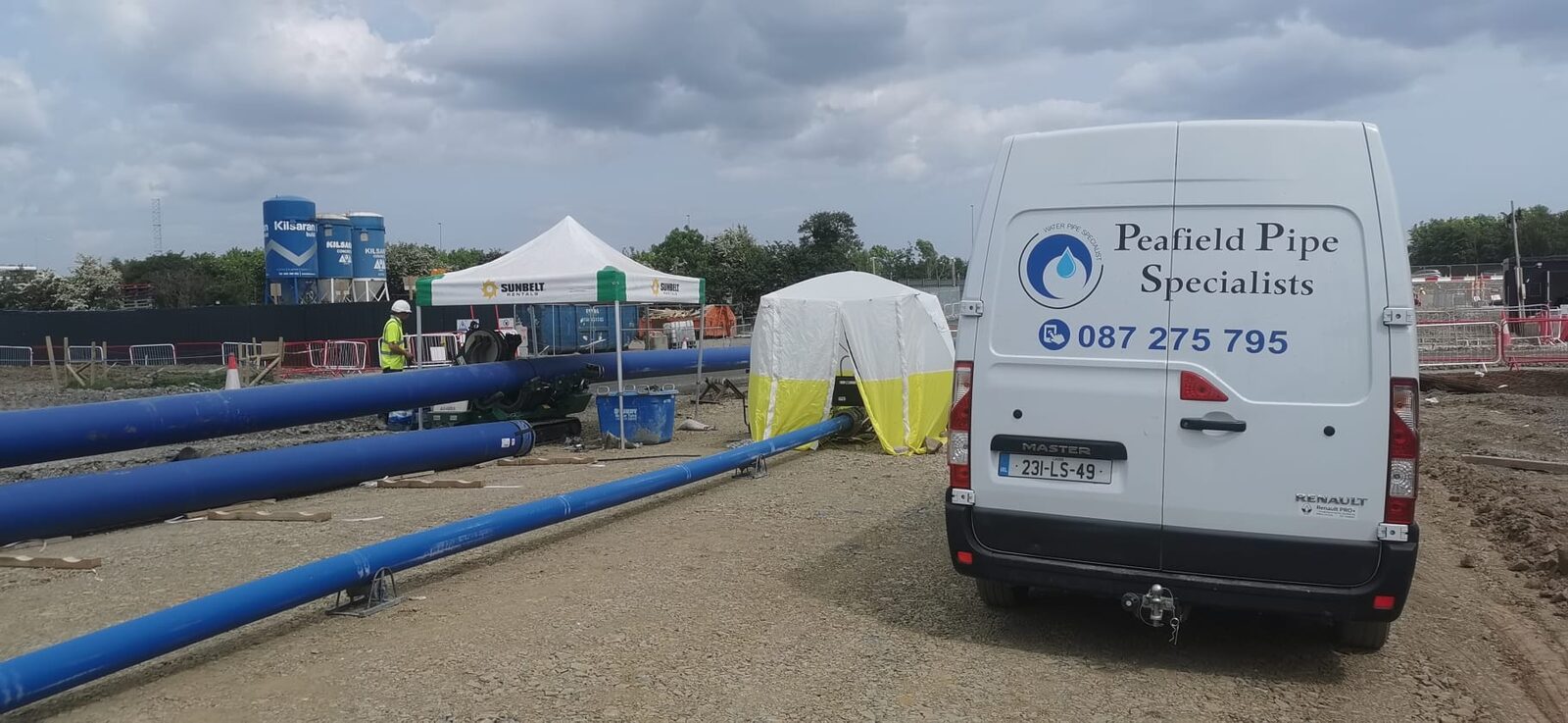 Two butt fusion welding machines set up on site
