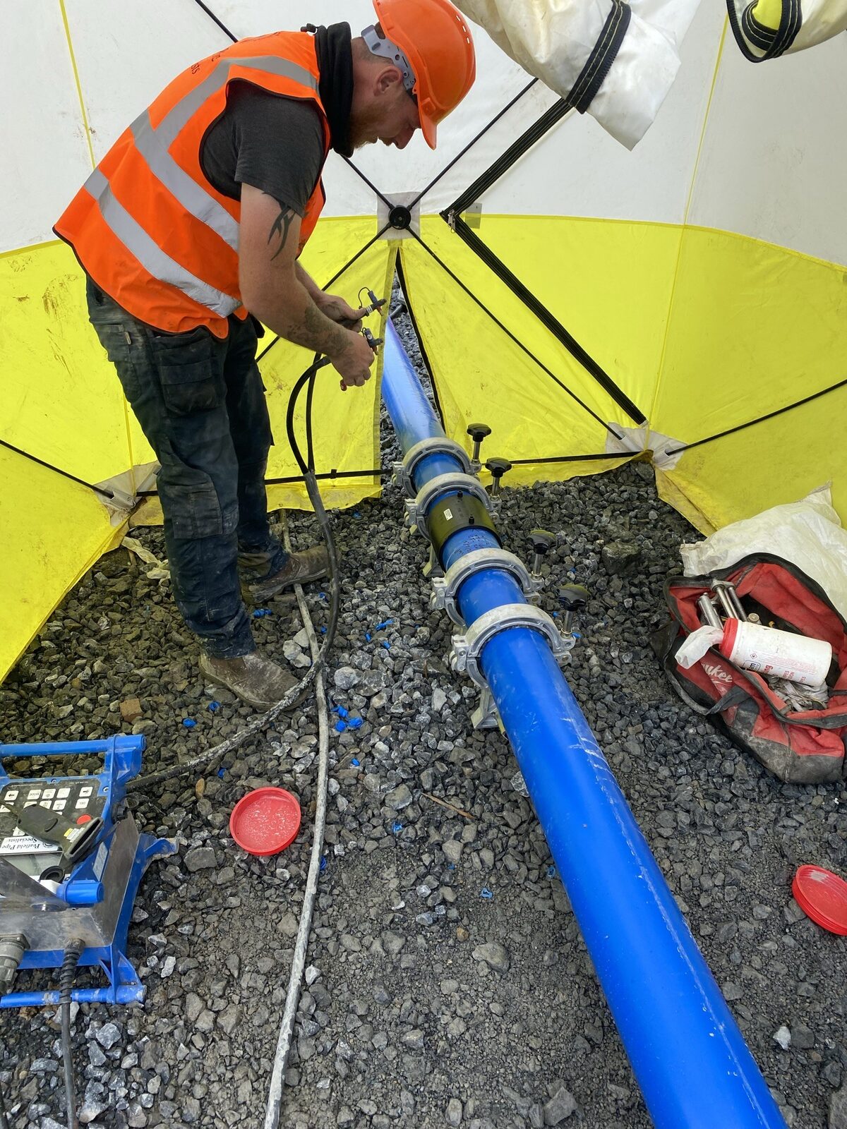 Electrofusion joint under test with alignment clamps