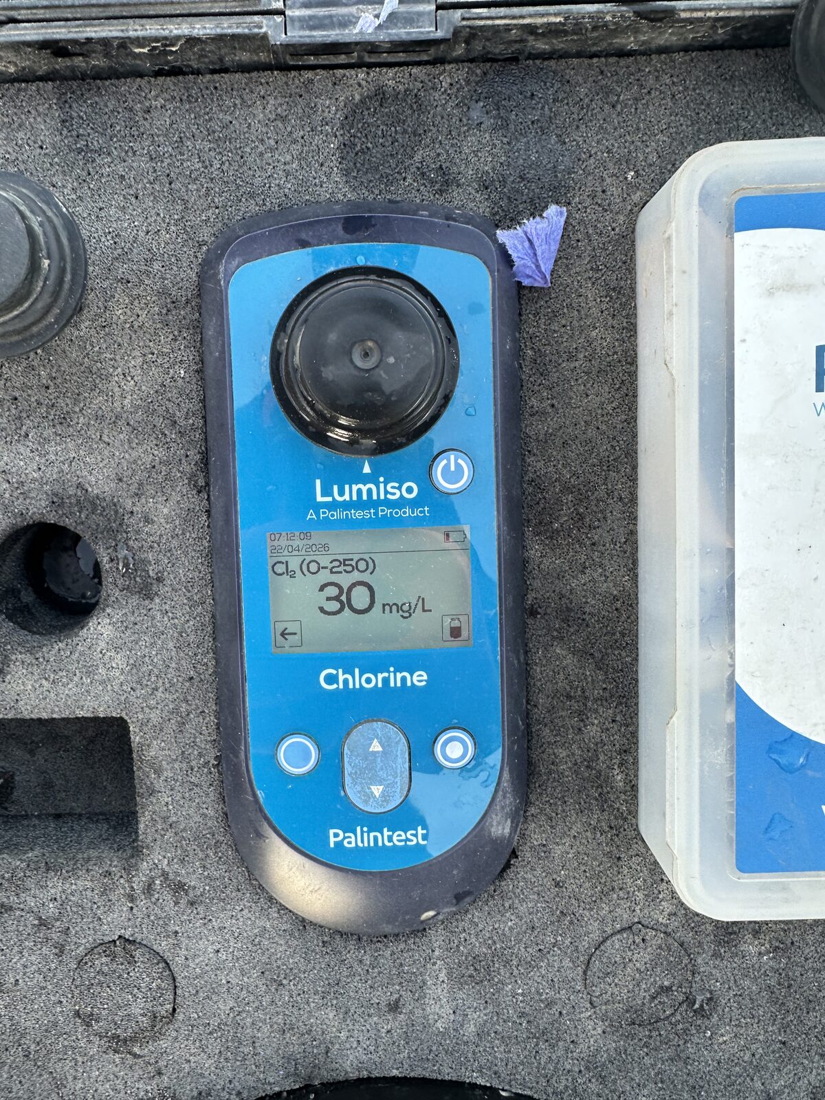 Palintest chlorine photometer showing 30 mg/L free chlorine during mains chlorination