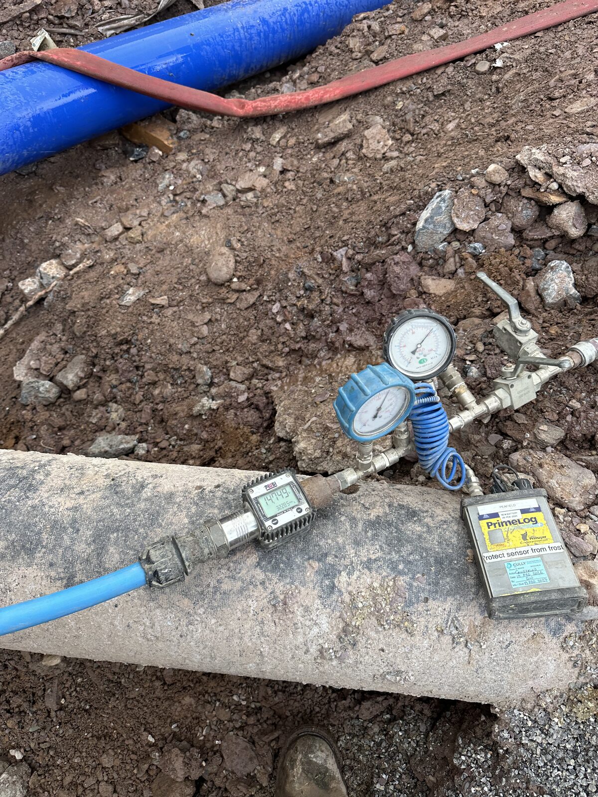 Data logger and flow meter during hydrostatic pressure test on existing main