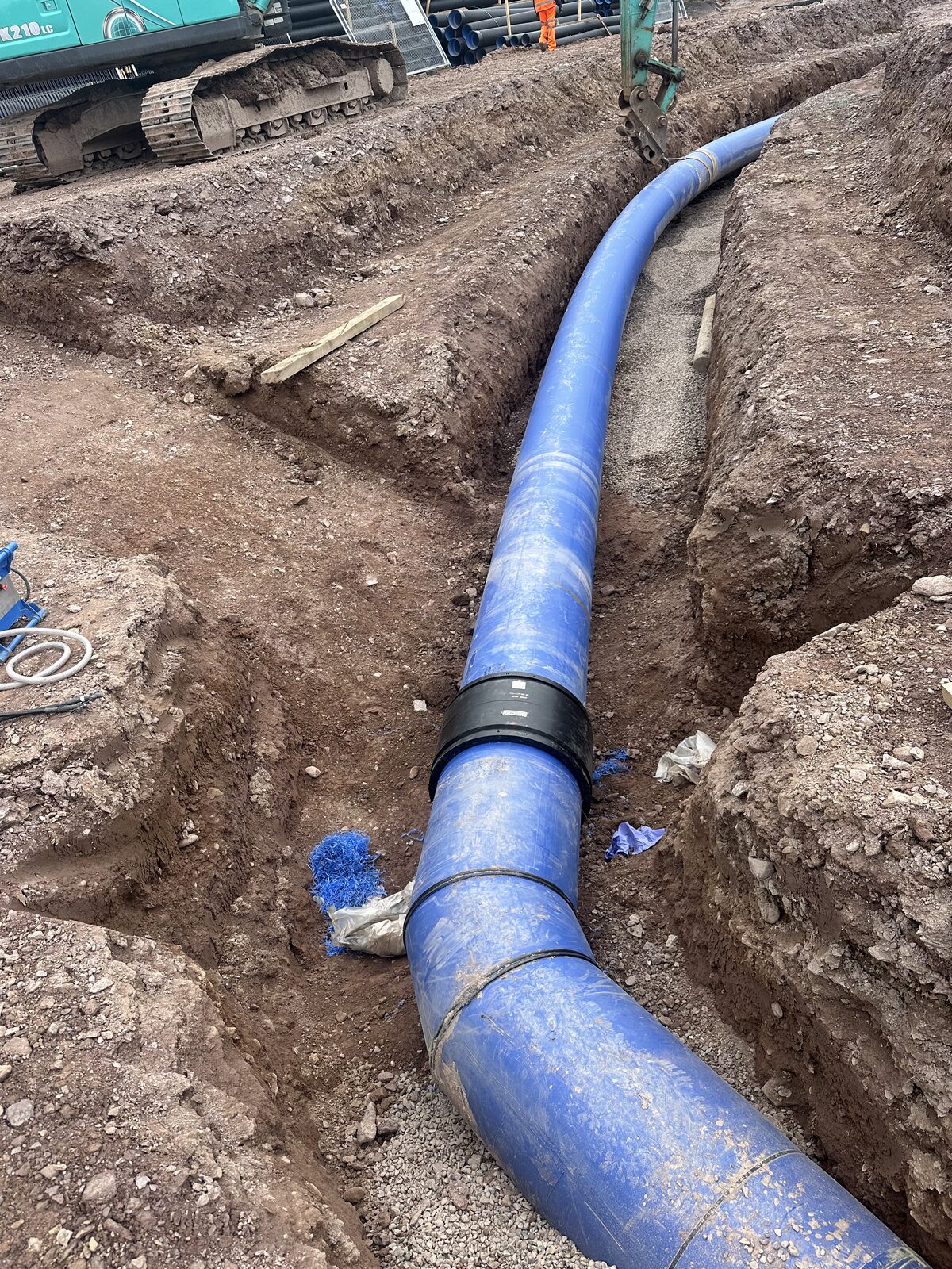 Large diameter HDPE water main with electrofusion coupler in trench