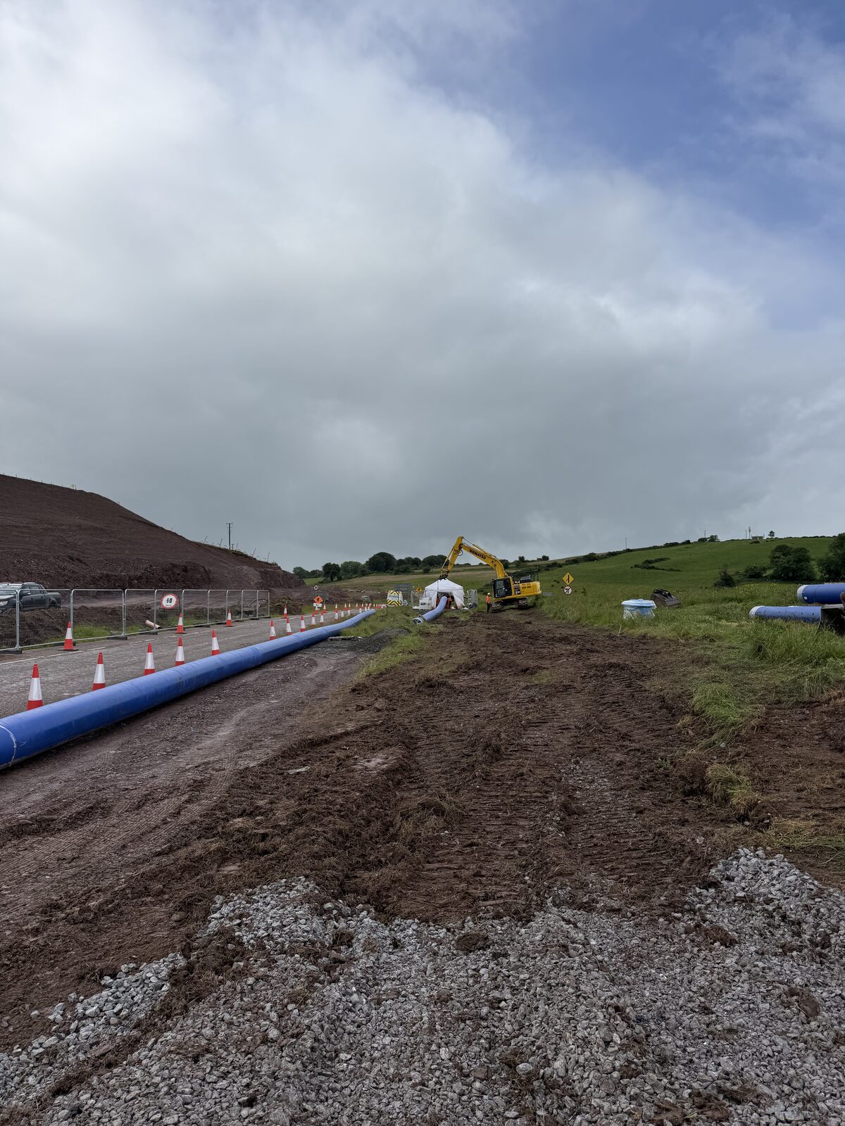 HDPE transmission water main installation with excavator